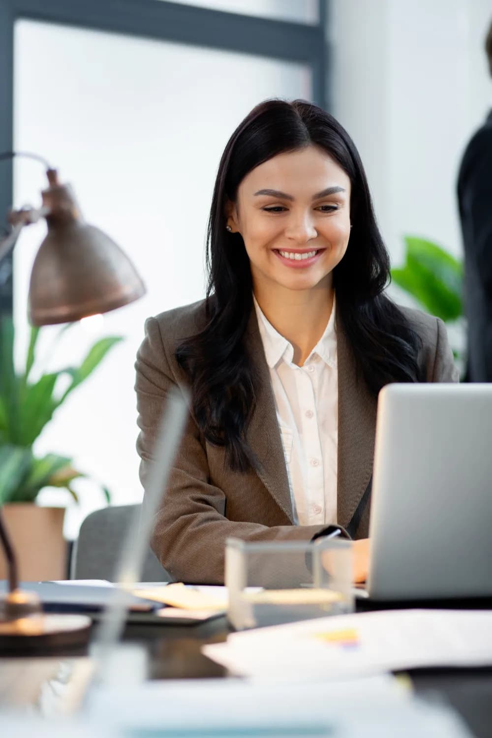Business consultant using invoicing software on a laptop